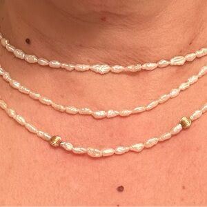 Fresh water Pearl triple strand with  Gold Beads